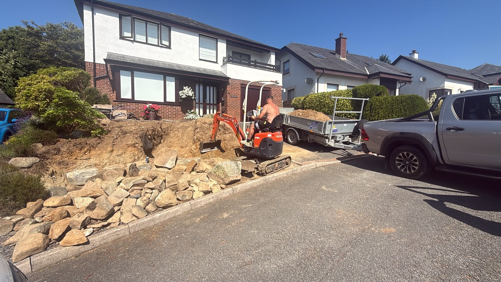 Natural stone retaining wall under construction in North Wales
