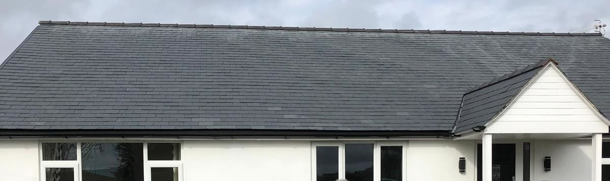 Roofing contractors in North Wales installing slate roof