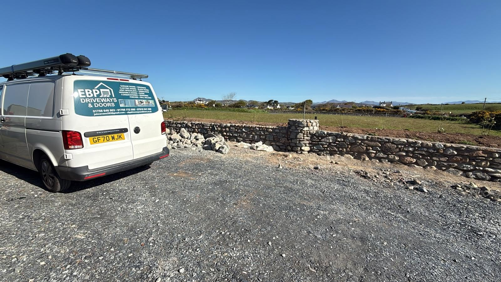 Rural natural stone boundary wall built by EBP North Wales