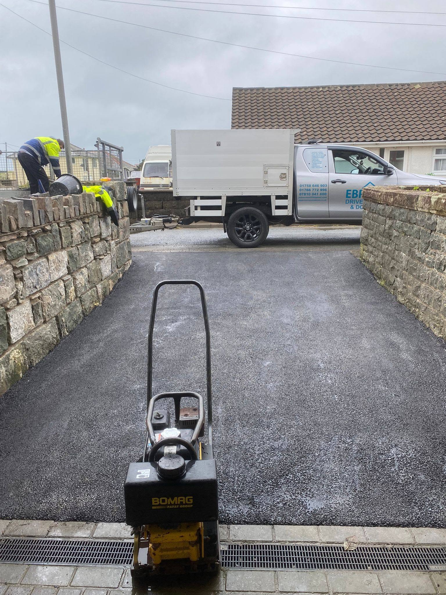 Tarmacadam driveway work with EBP vehicle North Wales